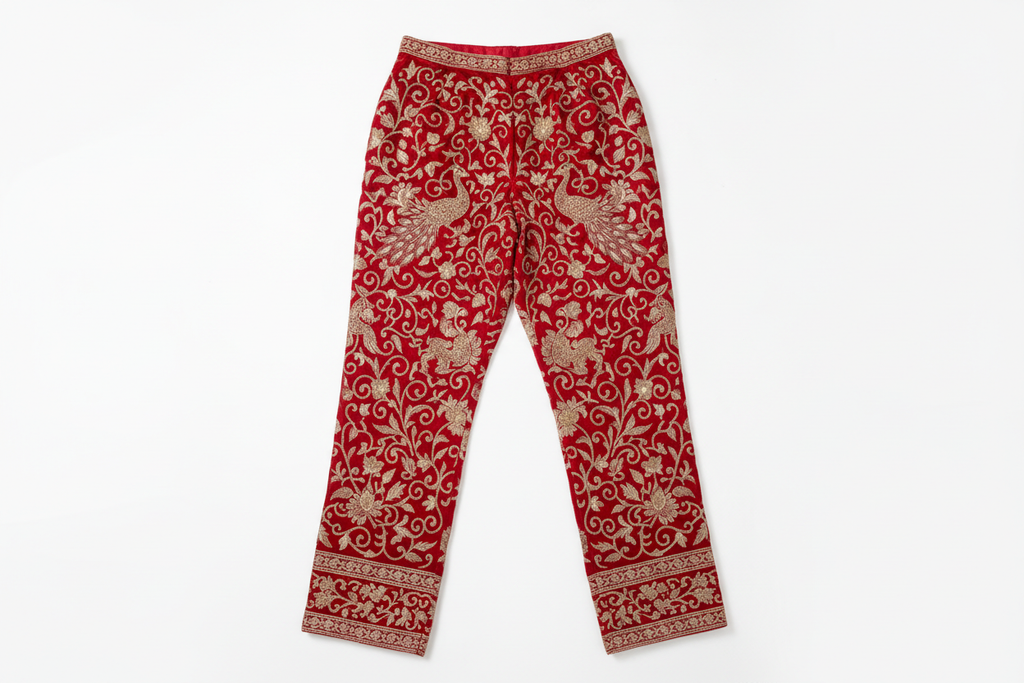 red embroidered pants on white background